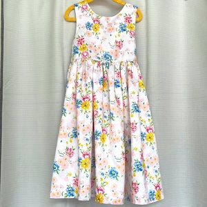 Girls size 6x casual dress . Dress is white with flowers.